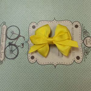 Belén Costales lazo aspa amarillo limón