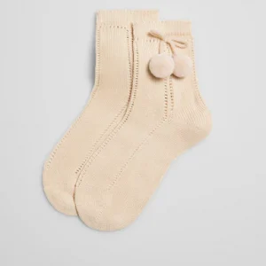 Calcetines calados perlé pompón beige